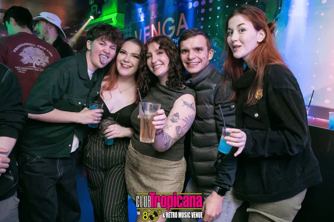 Group celebration with VENGA branding